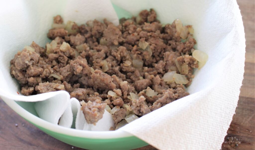 Placing the drained sausage in a paper towel lined bowl will help get a bit more excess fat off the sausage.