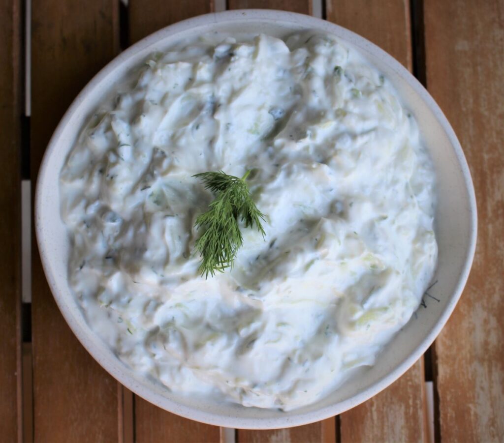 Greek yogurt, cucumber, fresh dill and lemon juice are the main ingredients in this creamy tzatziki sauce for your chicken burger pita pockets.