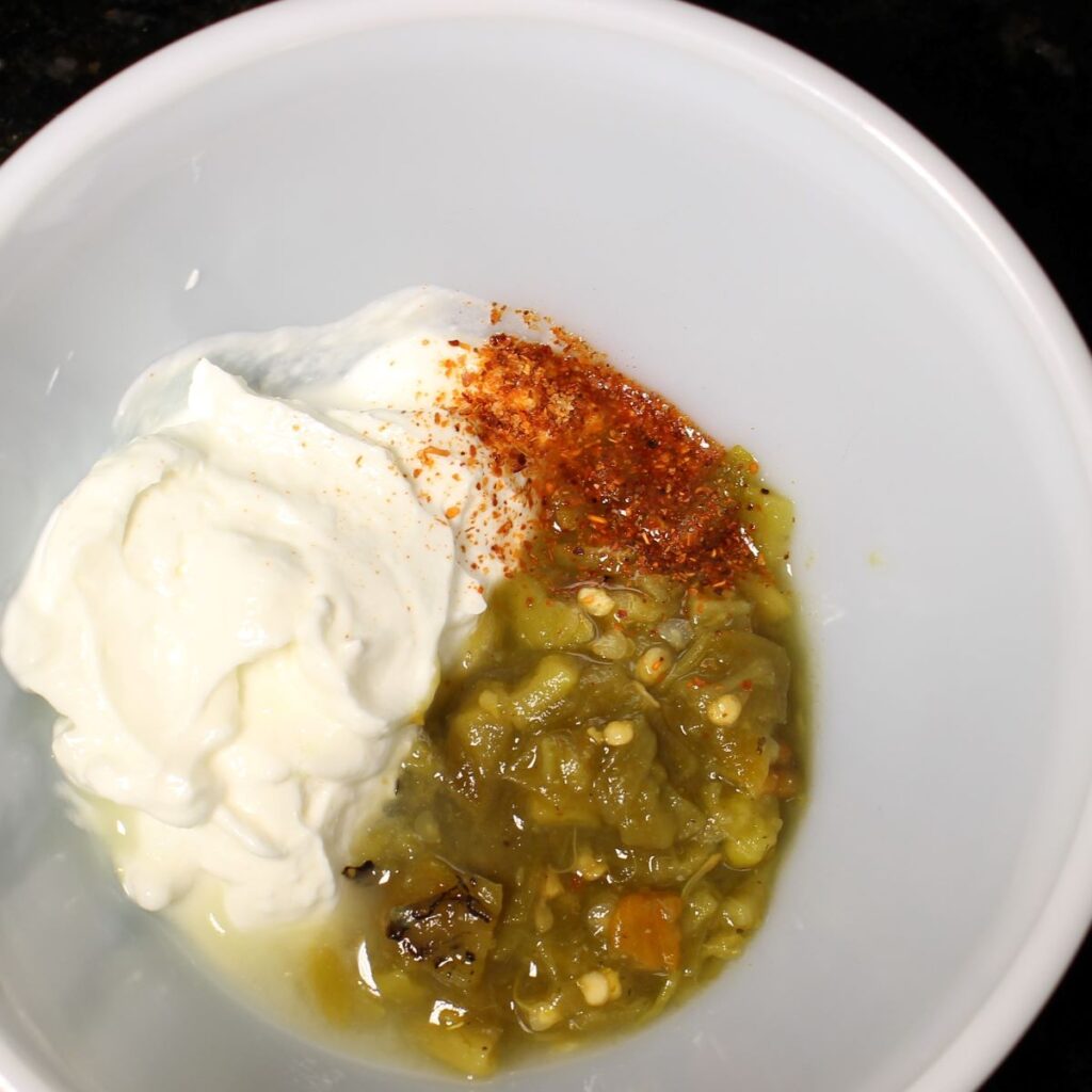 Easy spicy yogurt dressing, just 4 ingredients: plain Greek yogurt, salsa, lime juice, and tajin.