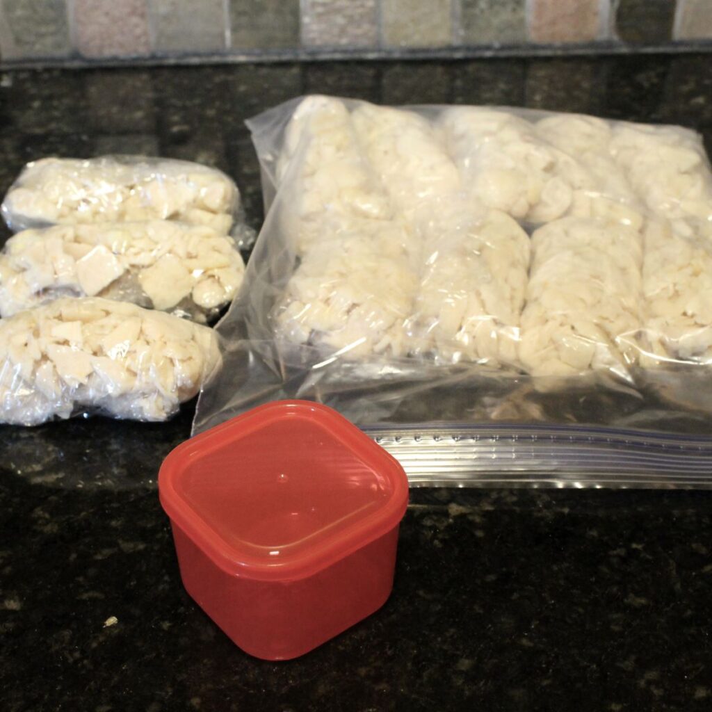 Portioned out rotisserie chicken breast. I like to use the red Portion Fix container from Beach Body. That way I know I'm getting the right amount of protein.