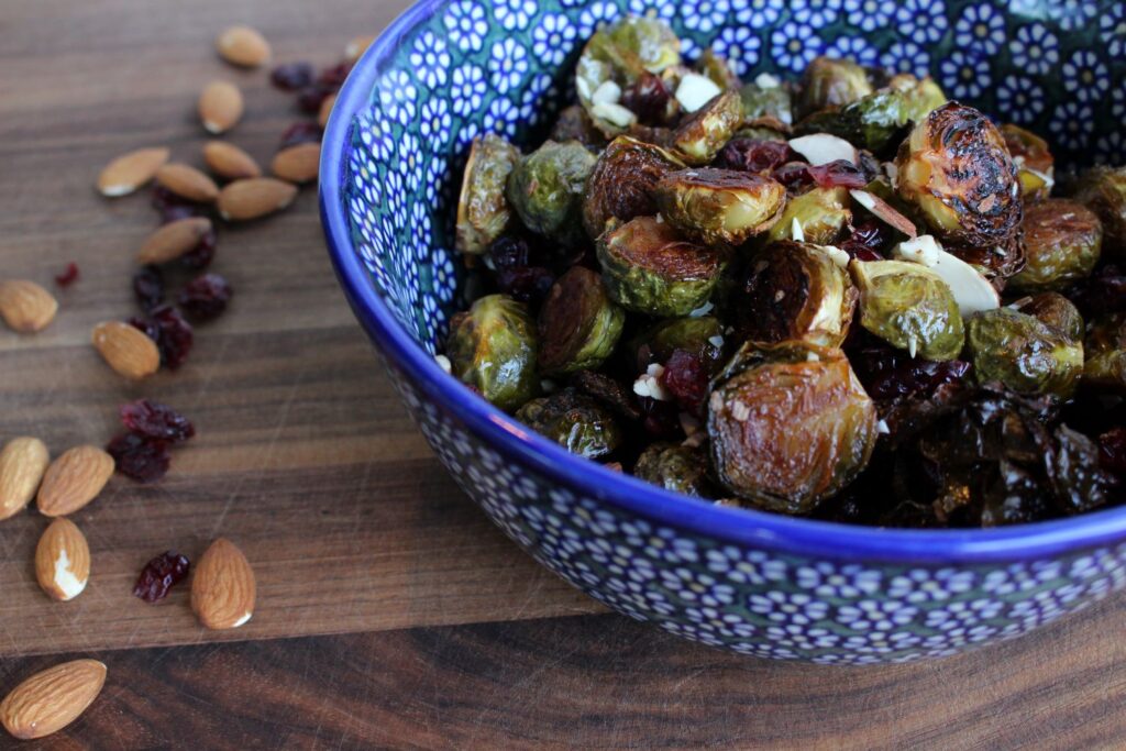 Roasted Brussels sprouts with cranberries and almonds in a Polish pottery bowl