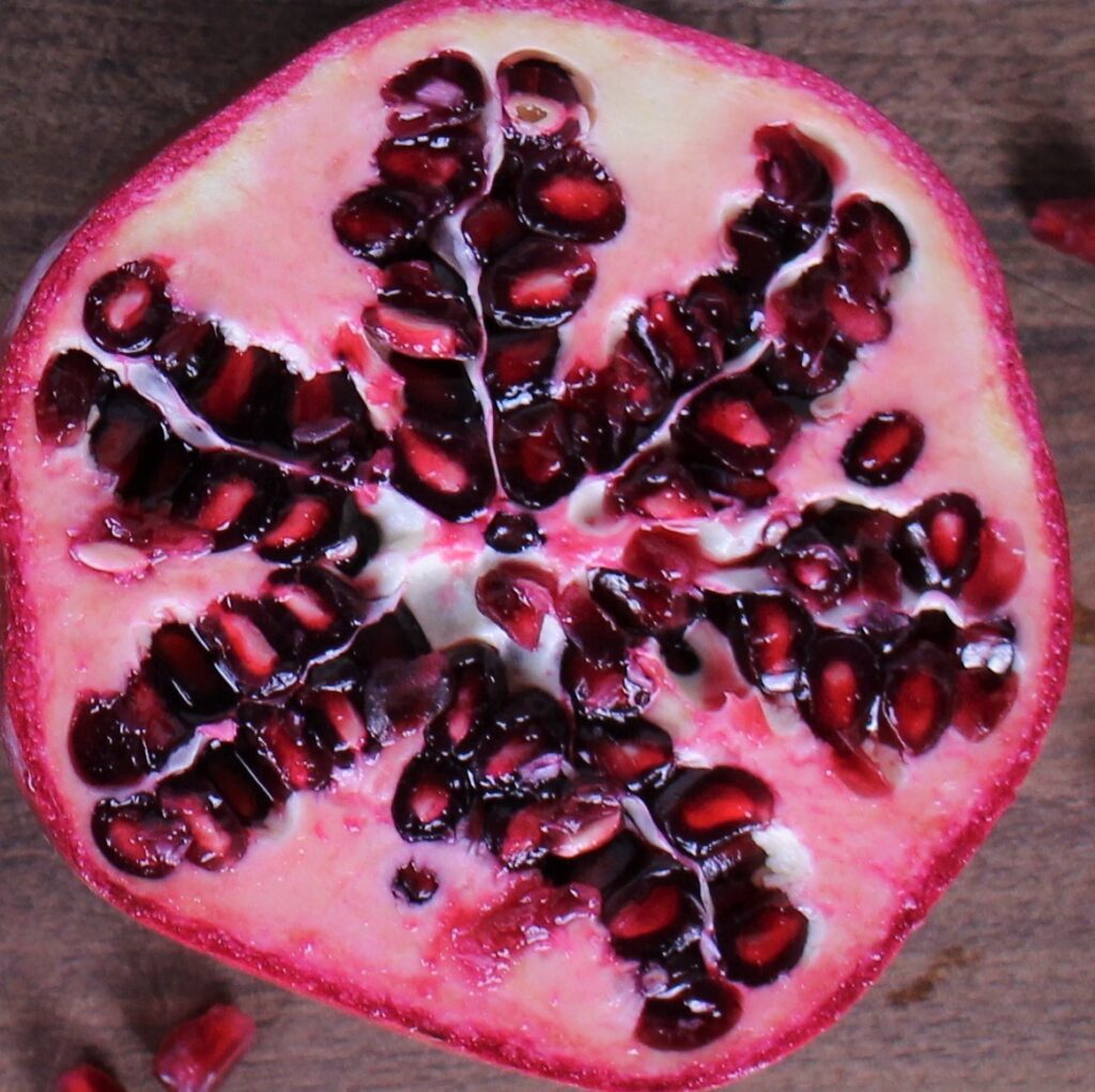 Halved pomegranate with alot of arils