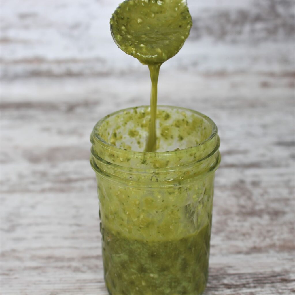 Only 4 ingredients in this healthy homemade salad dressing: pesto, lemon juice, olive oil, and salt.