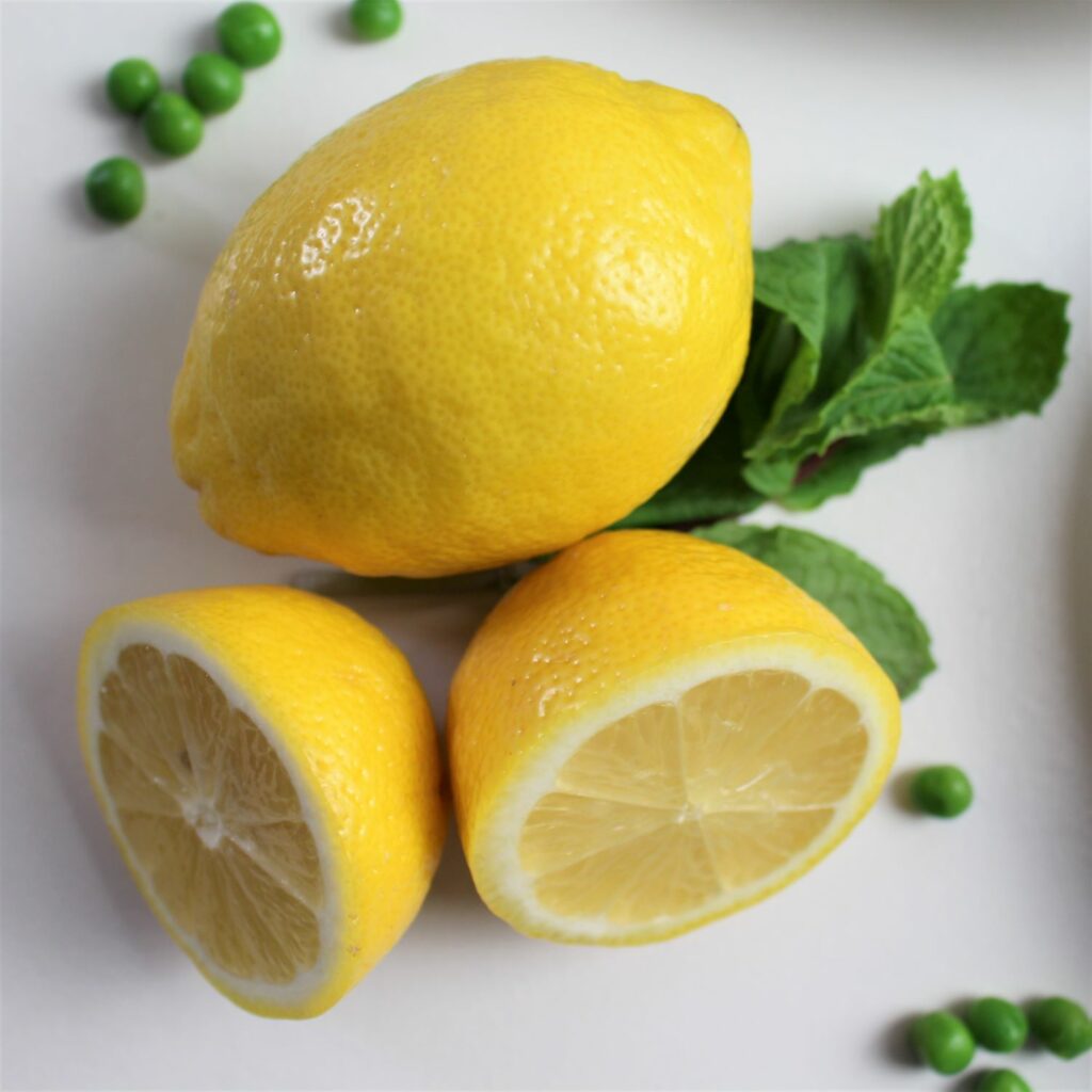 fresh lemons with a sprig of mint