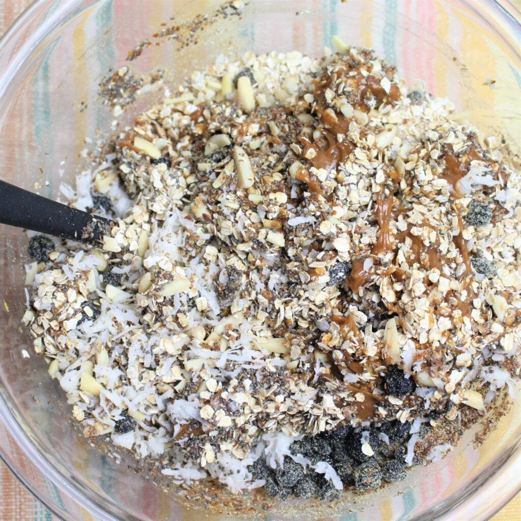 Mixing all the lemon blueberry energy ball ingredients together.