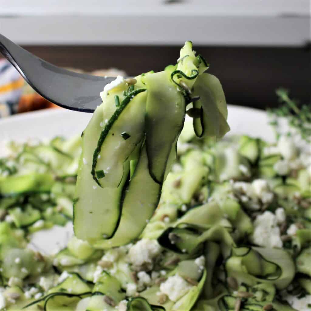 serving fork with zucchini ribbon salad on it