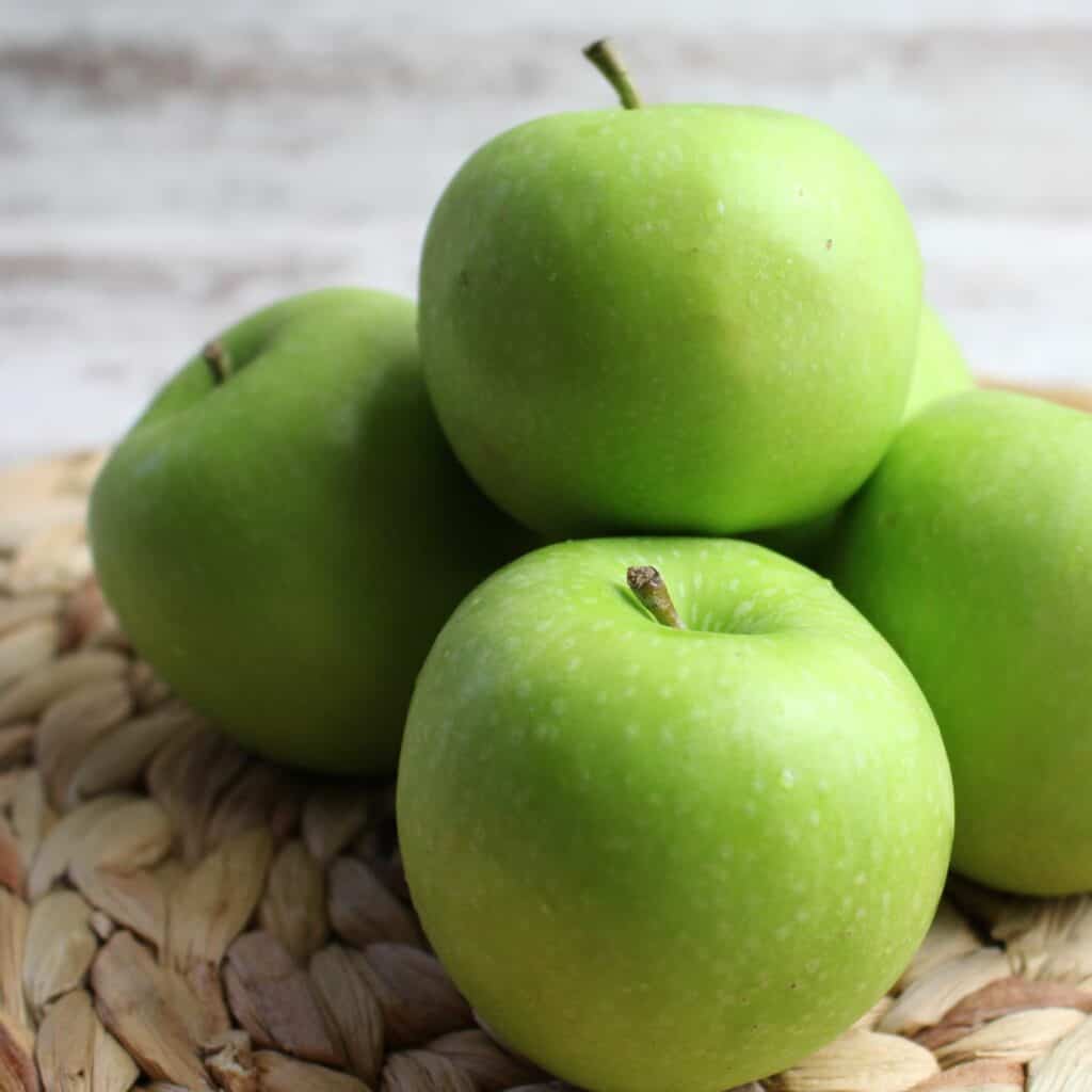 Granny Smith apples in a pile