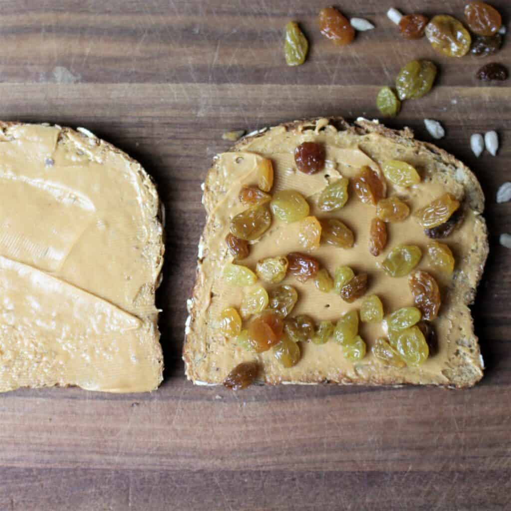 peanut butter spread on bread with raisins