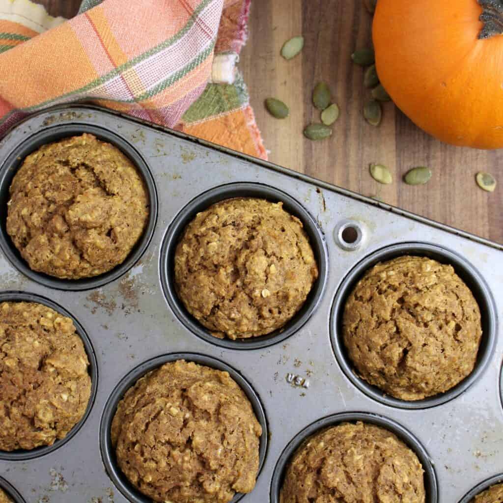 healthy pumpkin muffins right out of the oven in the muffin tin