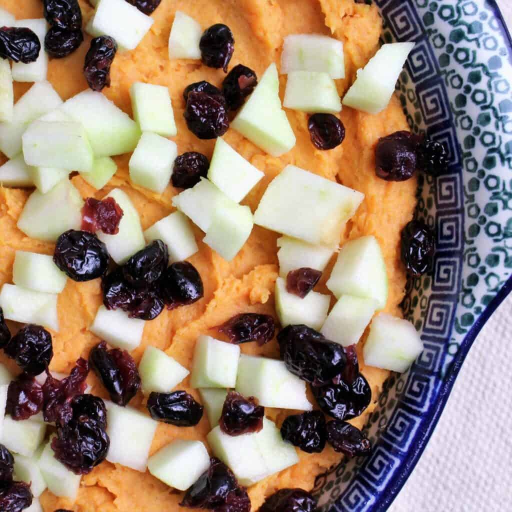 mashed sweet potatoes with diced apple and dried cranberries