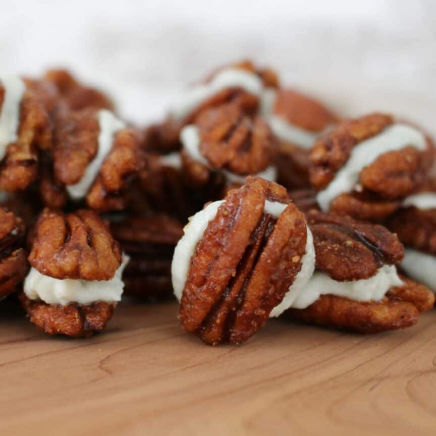 maple glazed pecans filled with blue cheese cream and sandwiched together.