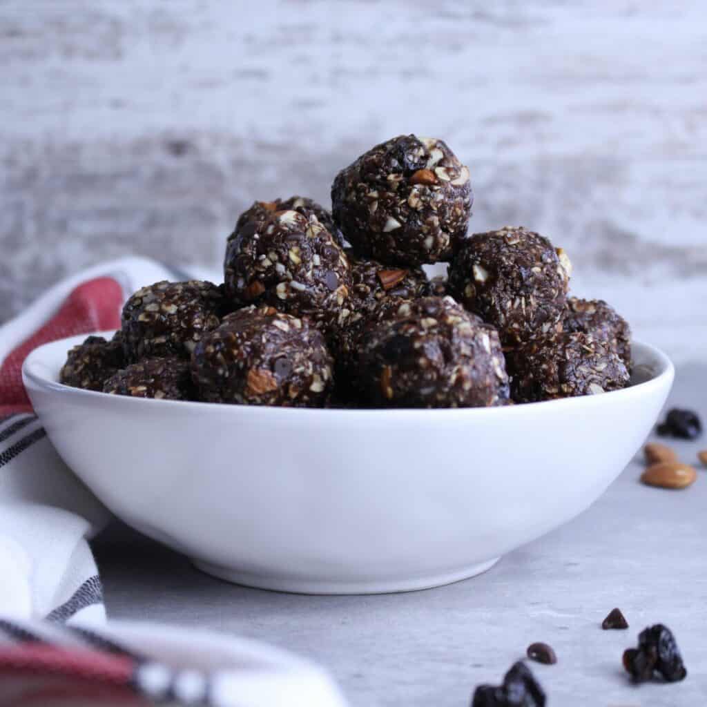 Double chocolate cherry energy balls in a bowl.