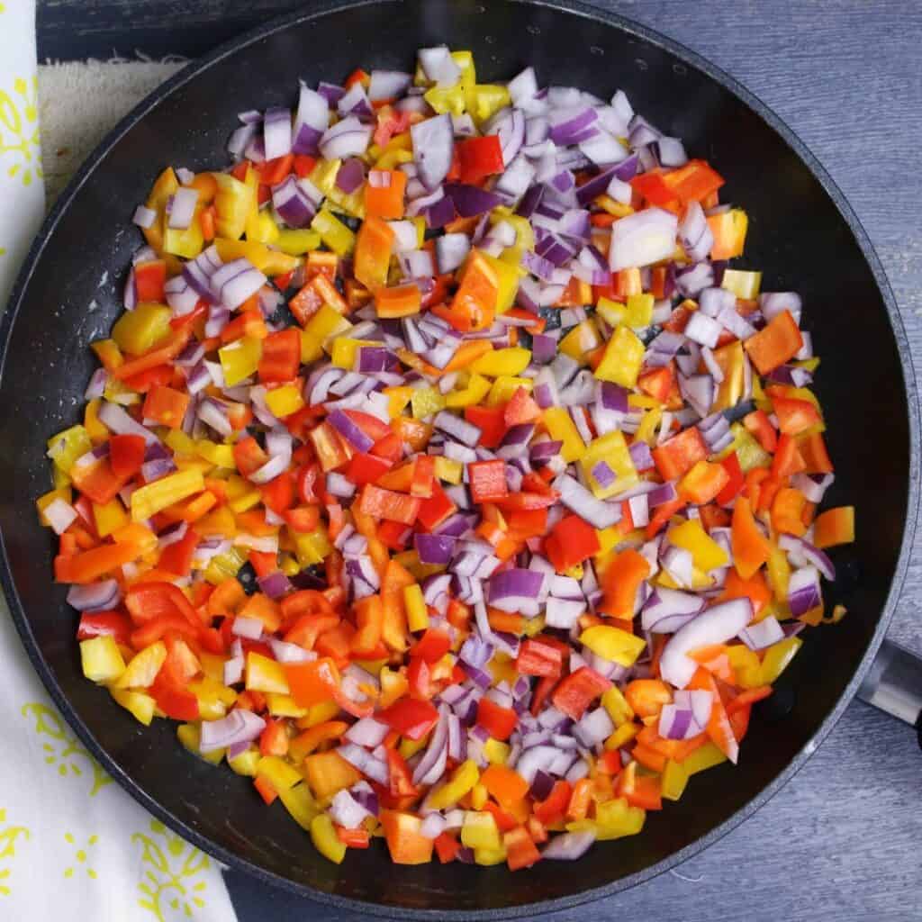A colorful mix of bell peppers, onions, and garlic sauteed until soft.