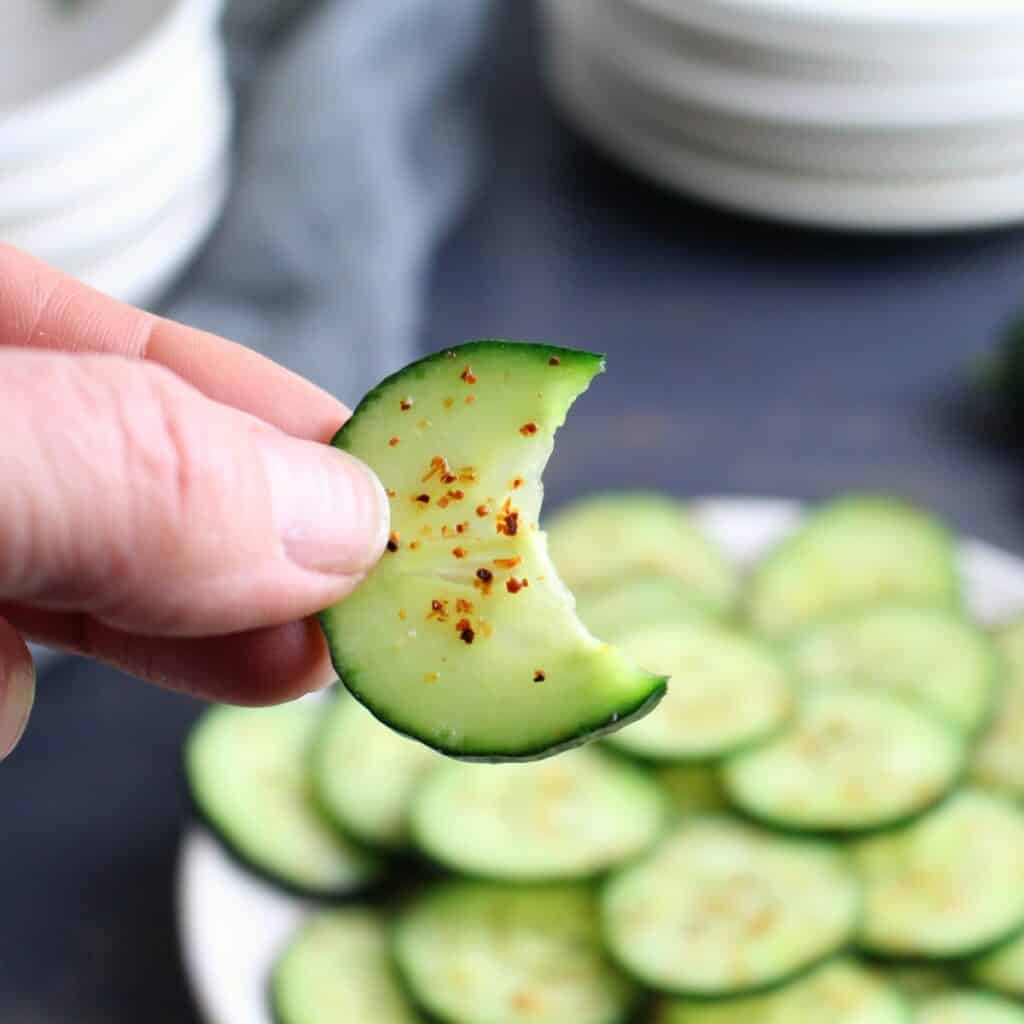Cucumbers sliced thin on a mandoline, sprinkled with tajin, and a bite enjoyed.