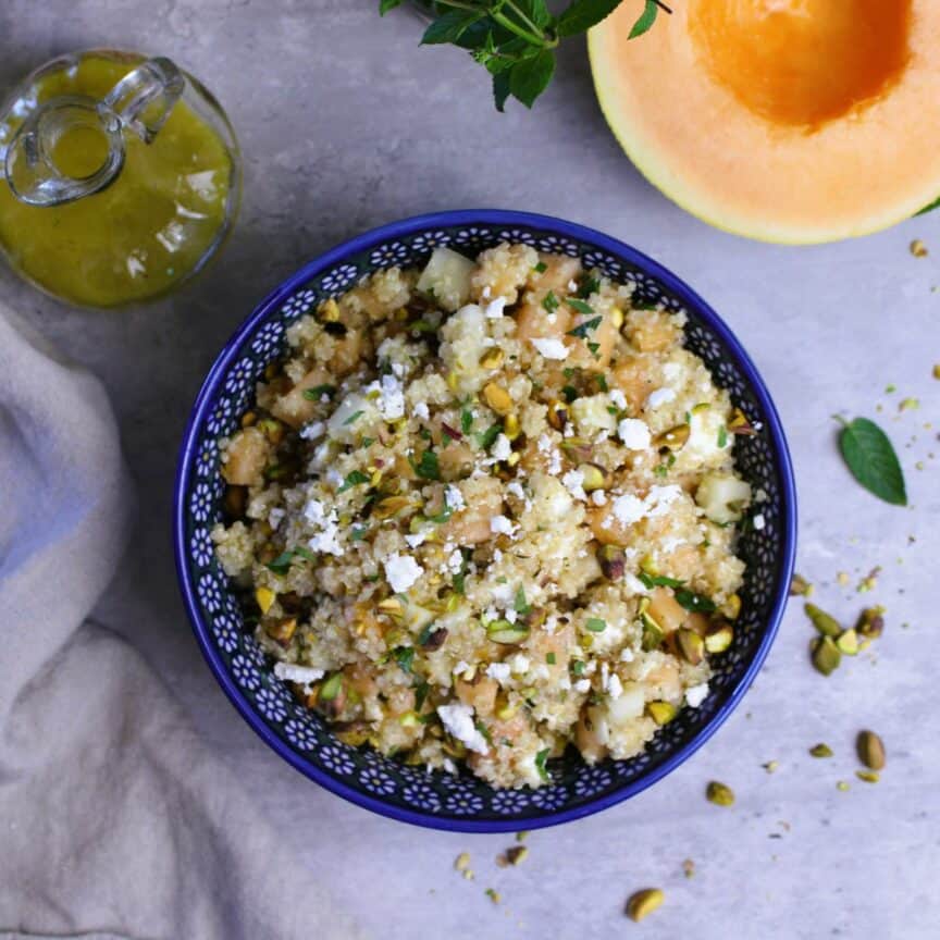 Cold quinoa salad with cantaloupe and goat cheese.