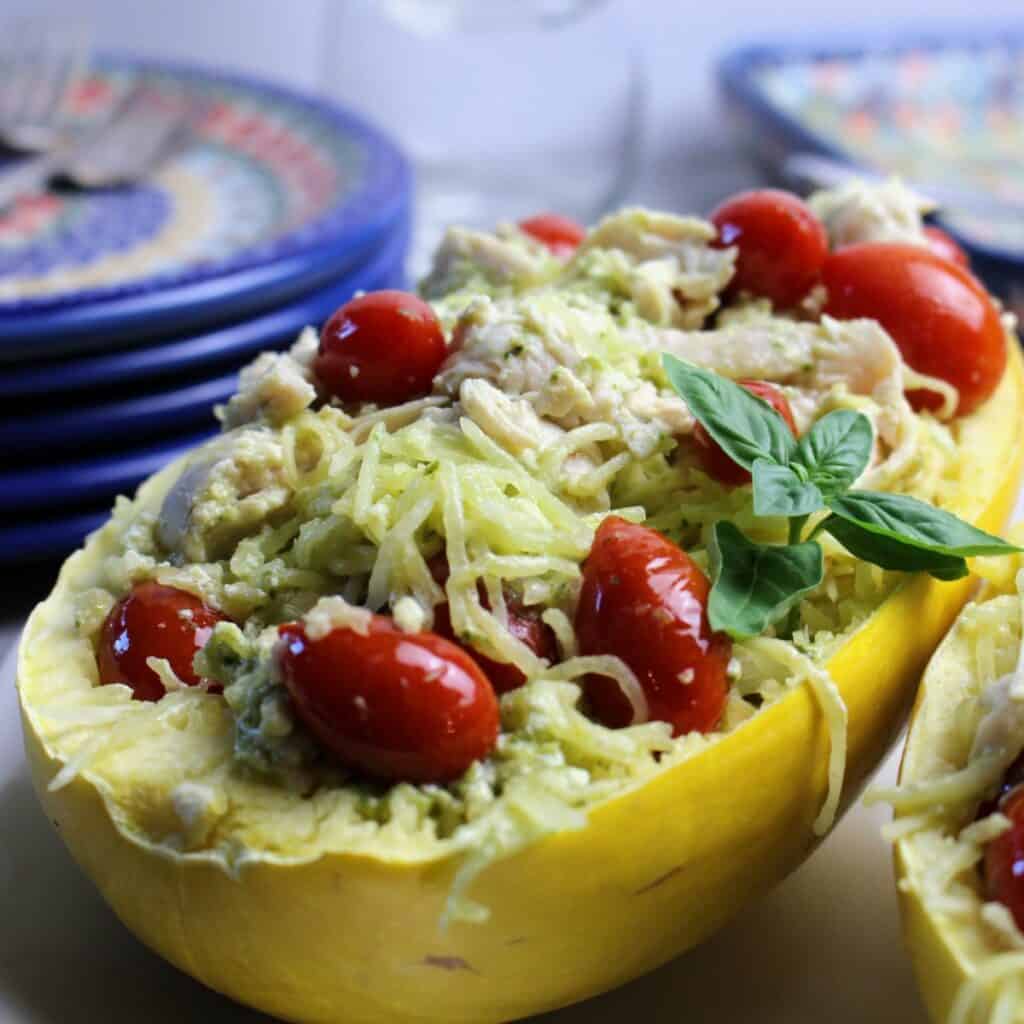 Spaghetti squash shell filled with squash, pesto, cherry tomatoes, and goat cheese.