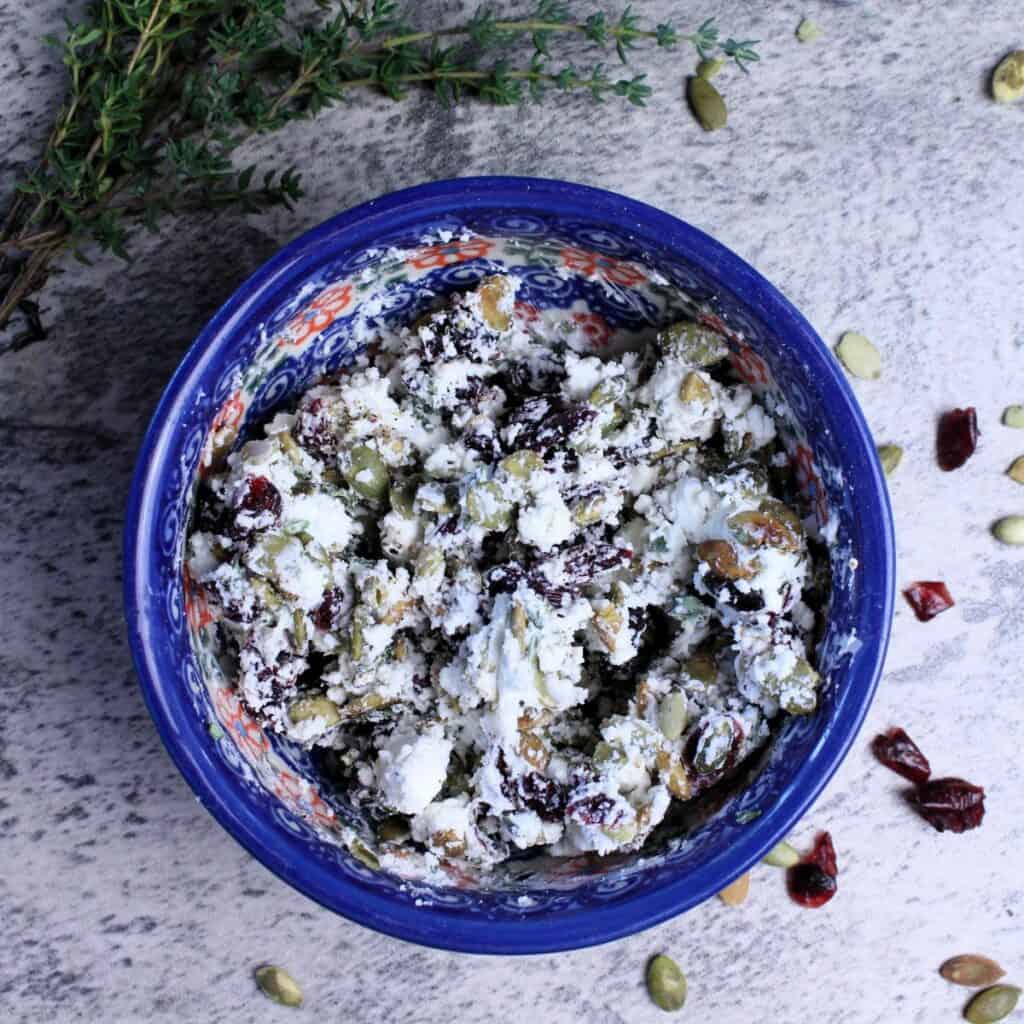 Goat cheese cranberry crumble with pumpkin seeds and fresh thyme.