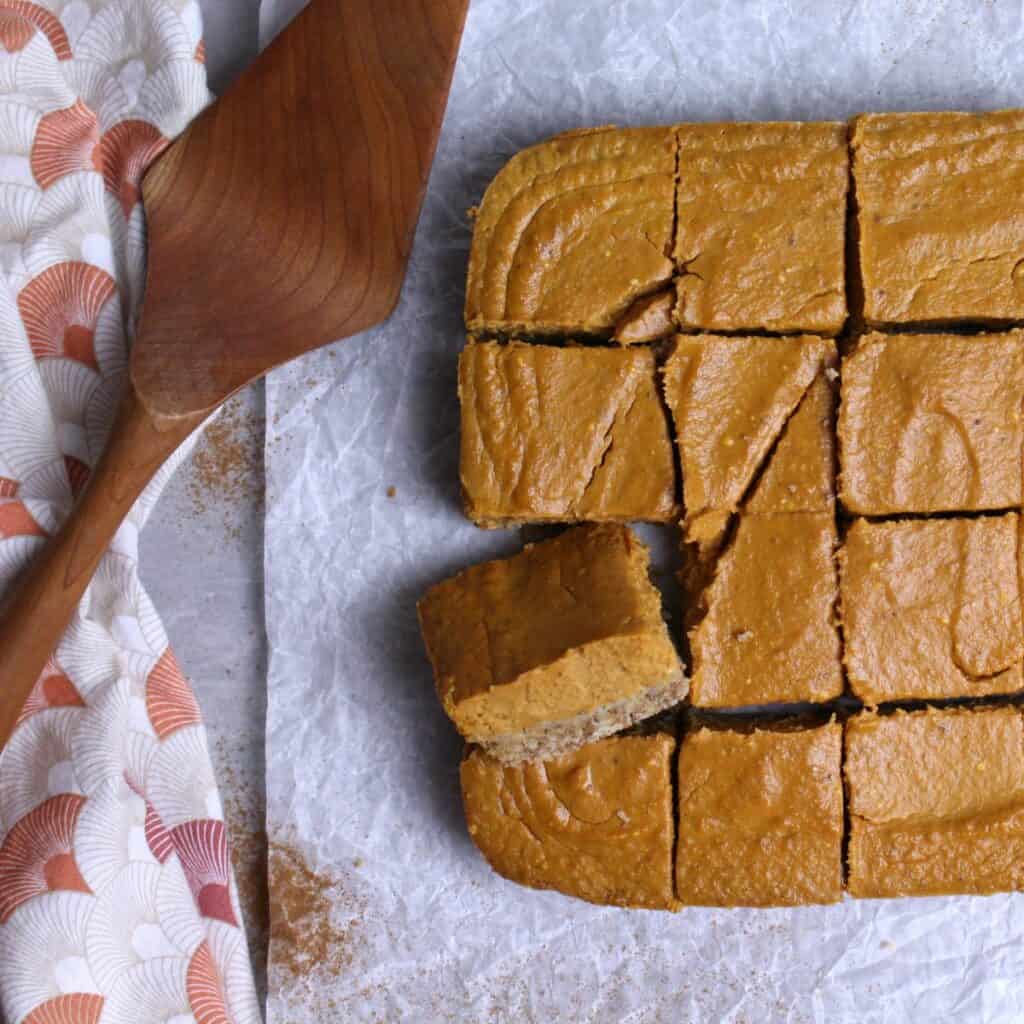 Creamy pumpkin pie bars with oat crust baked to perfection and cut into squares.