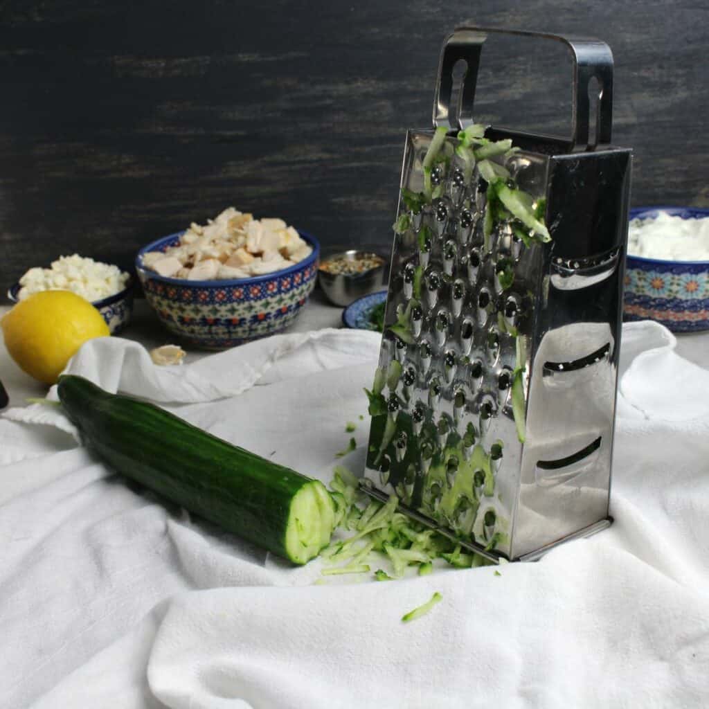 Shredded cucumber with box grater.
