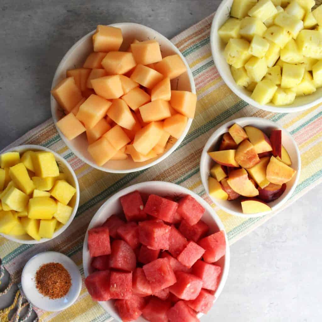 A colorful collection of fruit to sprinkle with tajin.