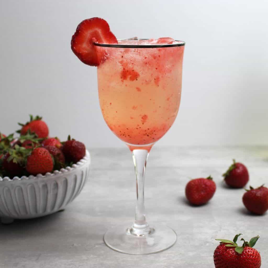 Strawberry Spritzer complete with strawberry puree, white wine, and seltzer.