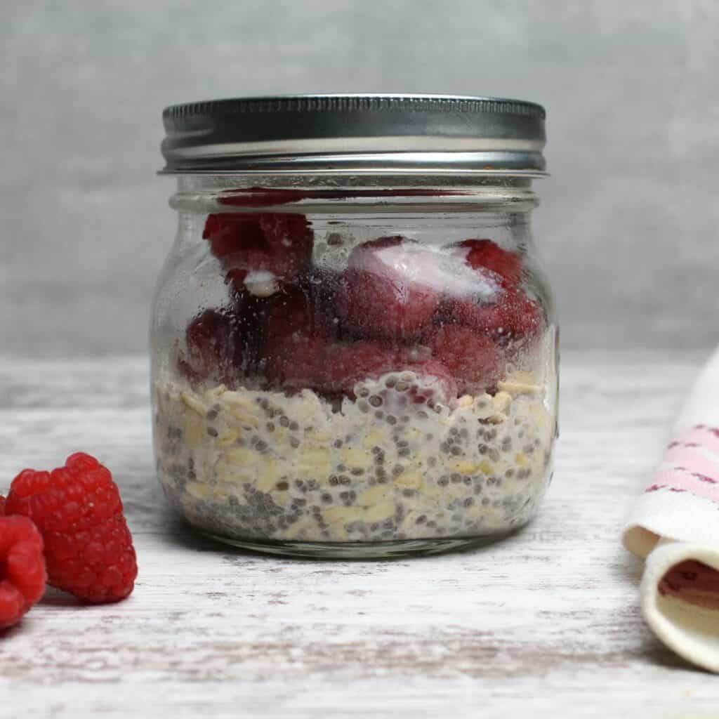 Mason jar filled with ready to eat overnight oats.