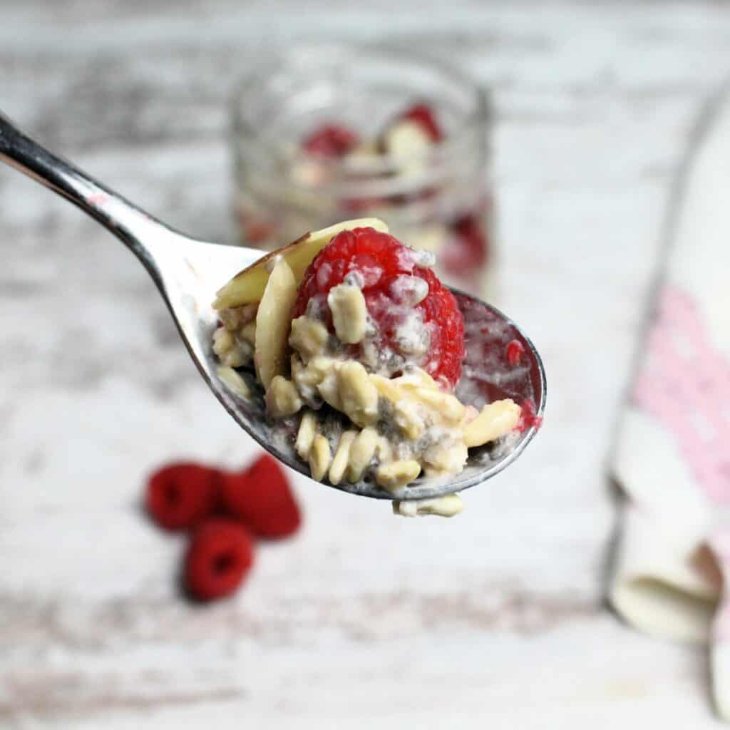 A spoonful of Overnight Oats with Raspberries.