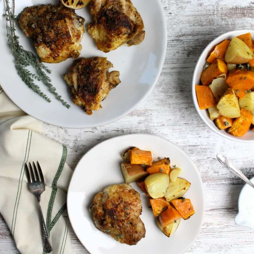 Chicken thighs and veggies plated and ready to eat.