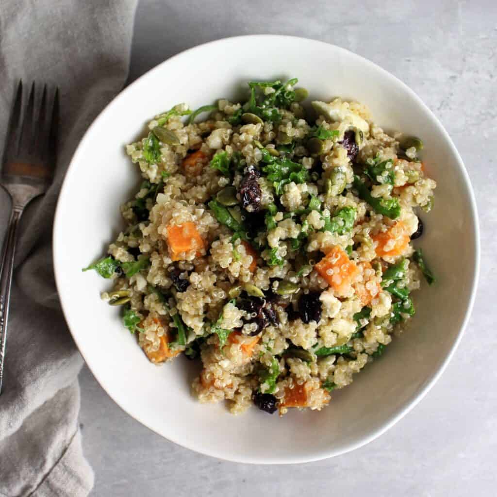 Colorful autumn quinoa salad in large serving bowl.