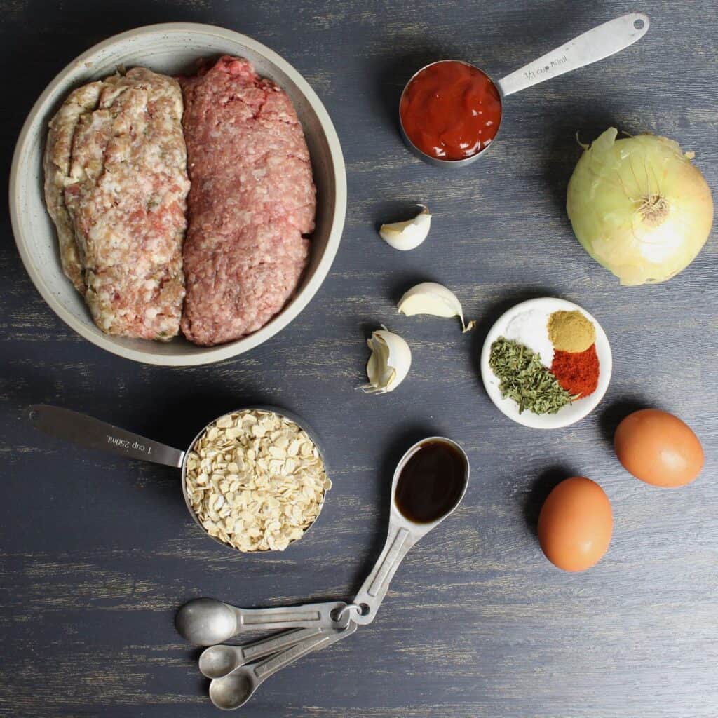 Ingredients needed for these meatballs are ground meat (beef, pork, or turkey), oats, ketchup, onion, eggs, spices, garlic, and Worcestershire. 