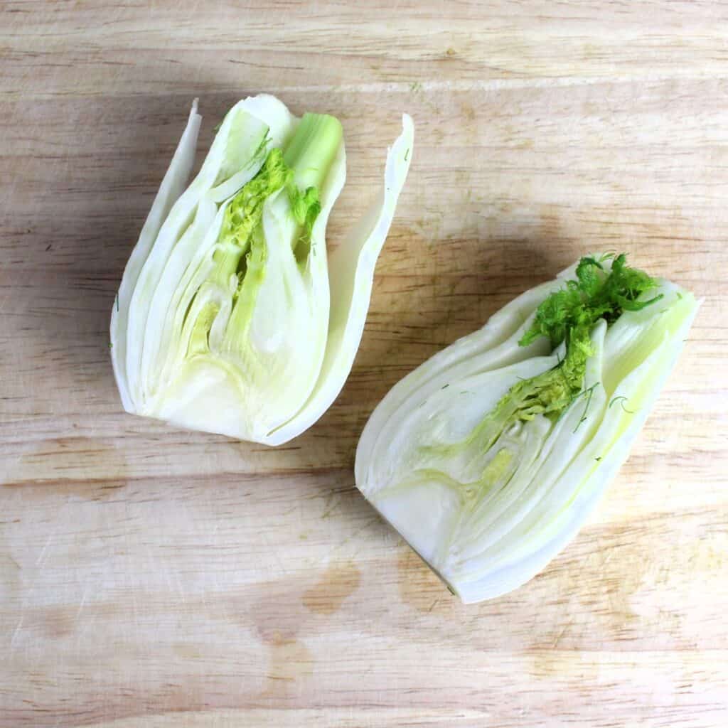 Fennel bulb sliced in half lengthwise.