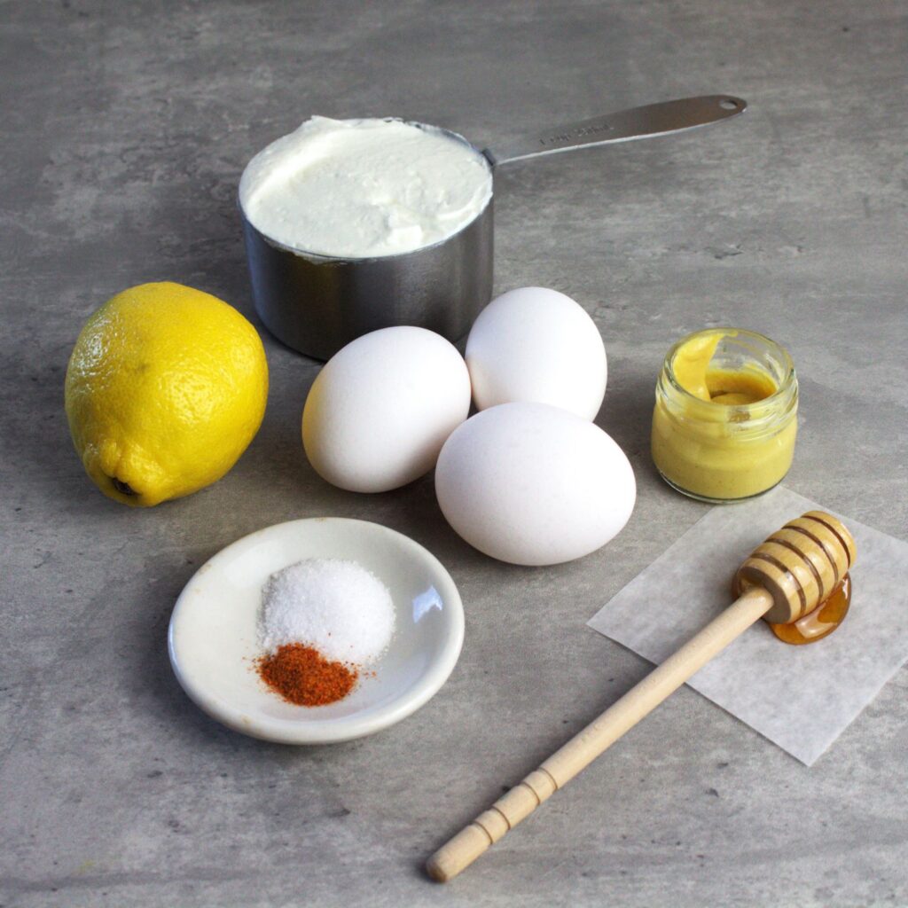 Ingredients needs to make a healthier hollandaise sauce are eggs, Greek yogurt, lemon juice and spices.