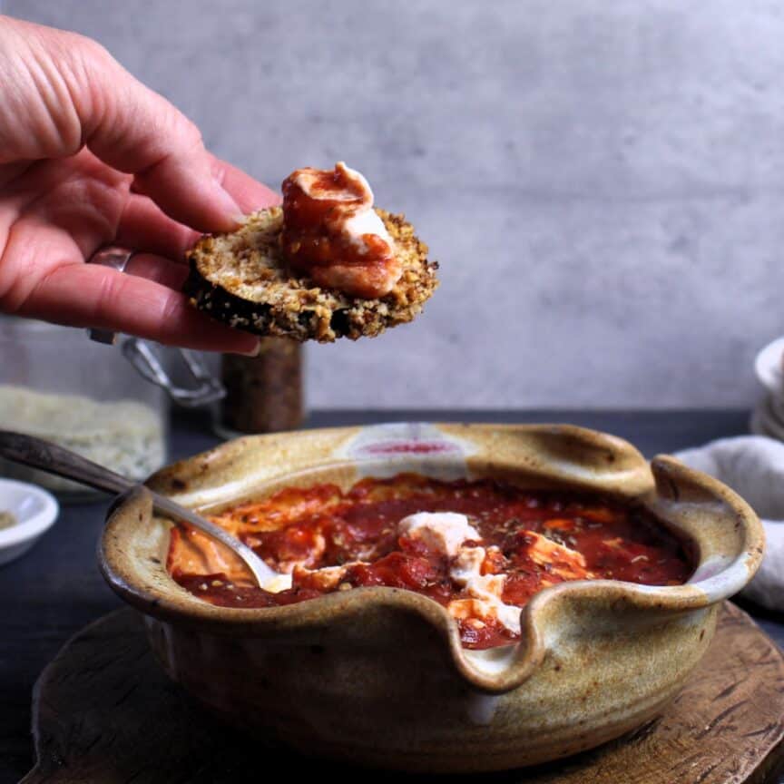 Baked Goat Cheese Marinara Dip on an air-fried eggplant slice.