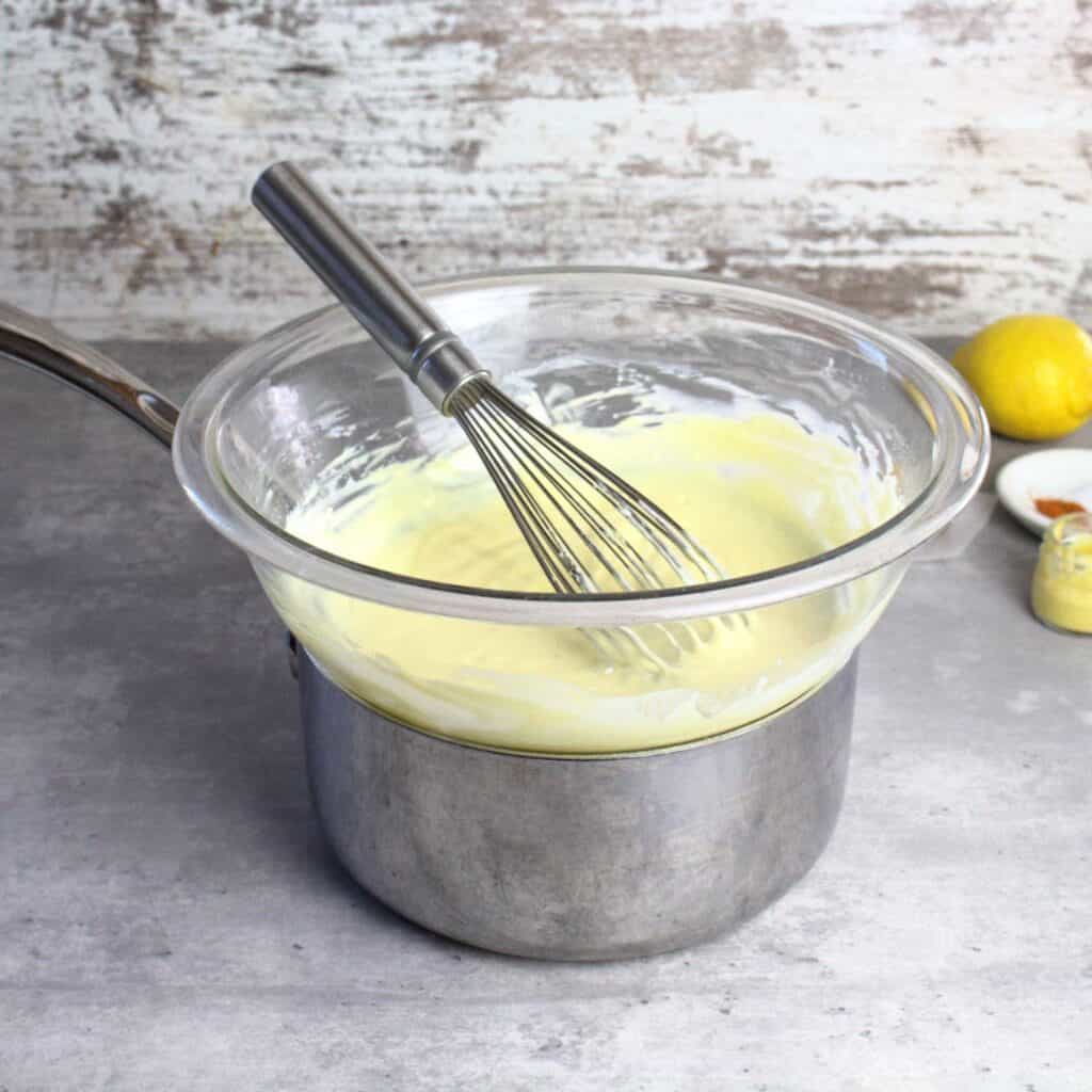 A pot and bowl create a double boiler for this Hollandaise sauce